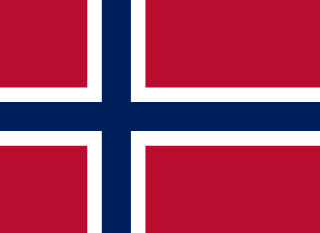 The flag of Bouvet Island has a red field with a large white-edged navy blue cross that extends to the edges of the field. The vertical part of this cross is offset towards the hoist side.